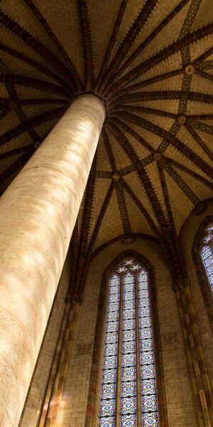 Pillar and colorful windows in Augustian convent